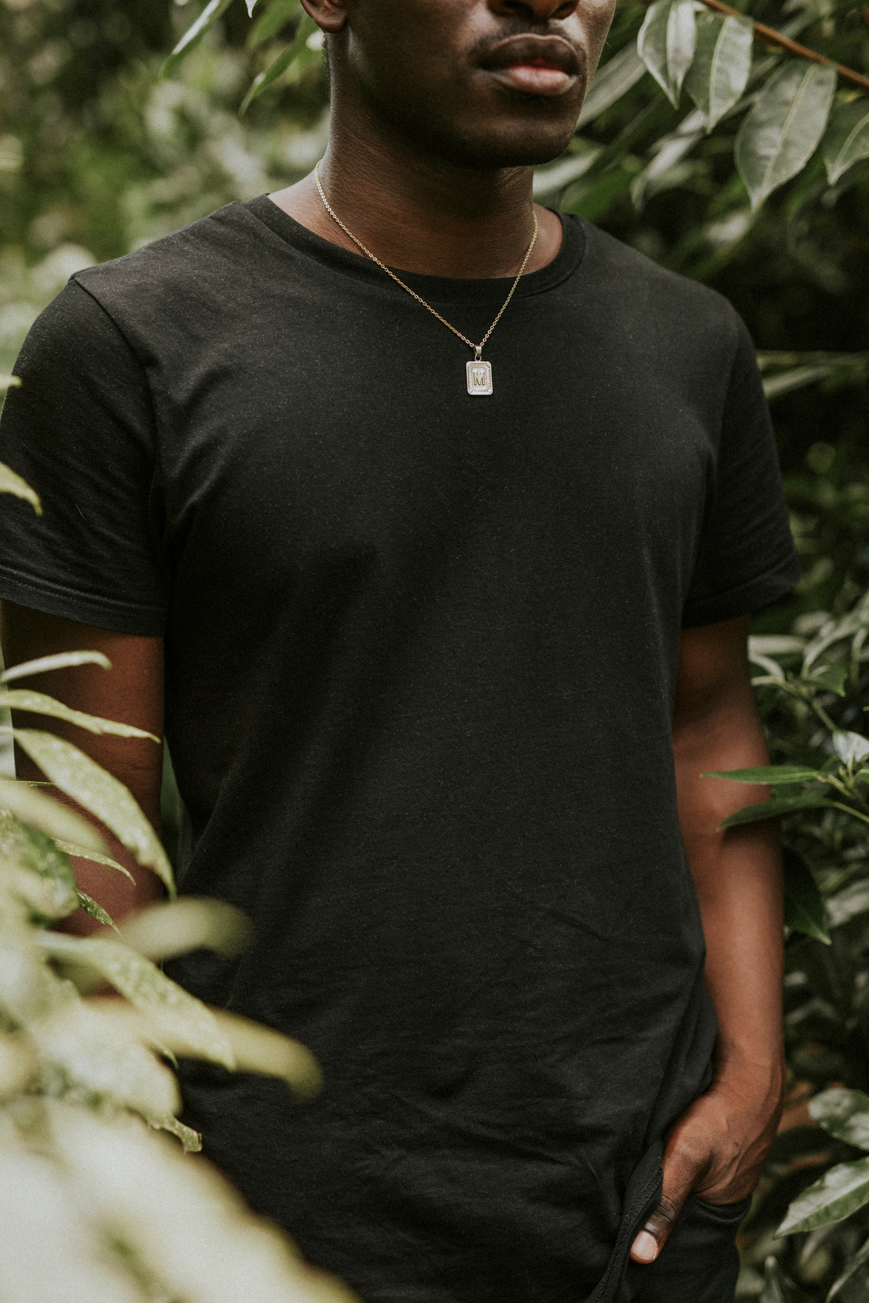 African American man in black t-shirt mockup outdoors